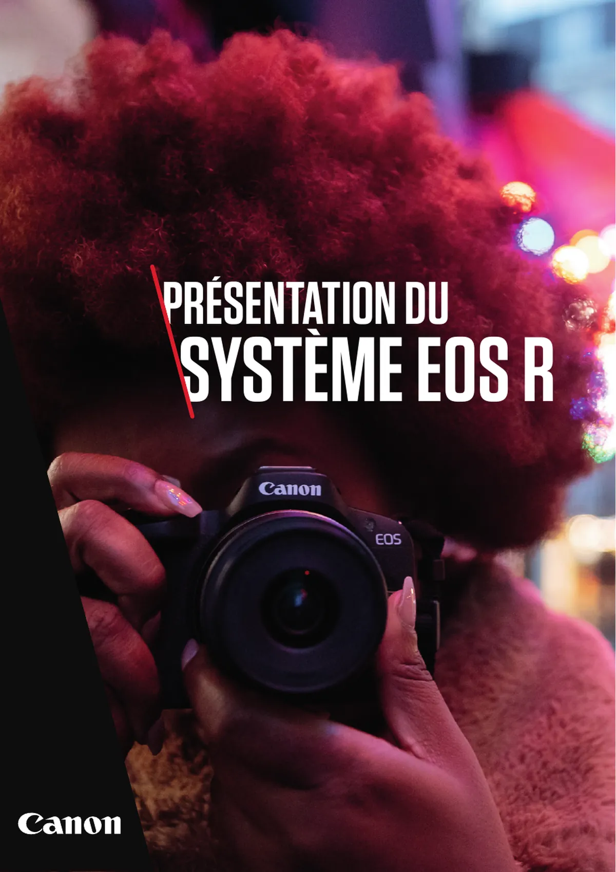 French edition cover of the EOS R System brochure: a close portrait of a photographer raising a camera to her eye under city lights, with the title set across it and the Canon logo below