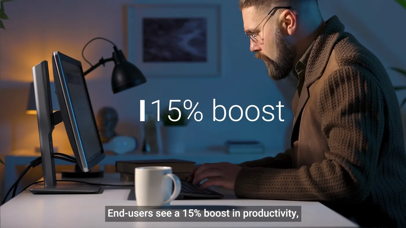A bearded man working at a monitor in a dim room, with 15% boost set large over the frame and the subtitle end-users see a 15% boost in productivity